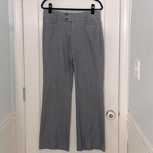 Navy, pinstriped slacks.